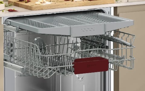 dishwasher with adjustable baskets and cutlery tray.