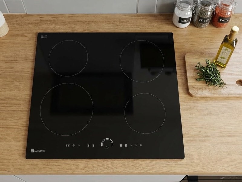 DeSantii induction hob with a black SCHOTT glass top on a wooden worktop, seen from above