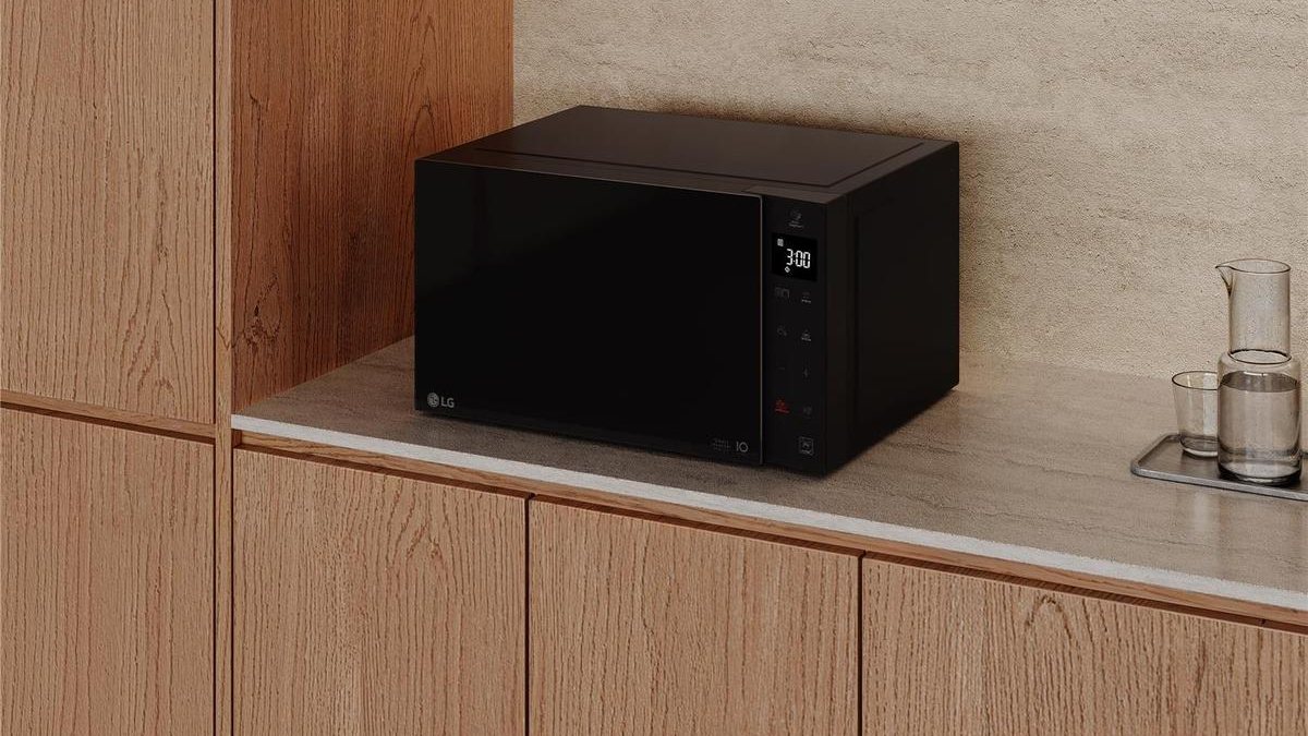Ovens, hobs and cookers buying guide: a microwave on a kitchen worktop